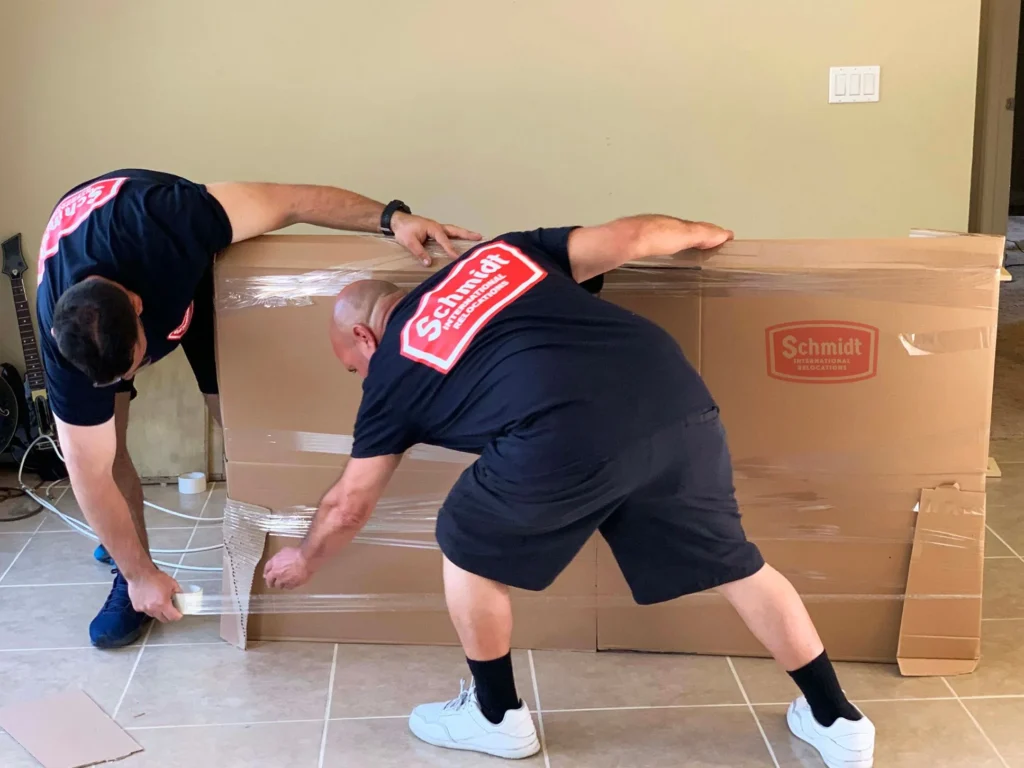 professional movers wrapping luxury furniture Palm Jumeirah villa Dubai