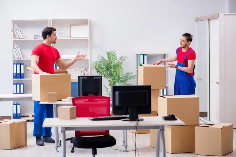 Same-day movers in JLT Dubai loading furniture urgently at tower cluster loading bay