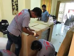 professional packers wrapping marble table foam board Palm Jumeirah frond